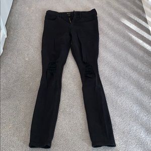 Mid rise skinny black ripped jeans